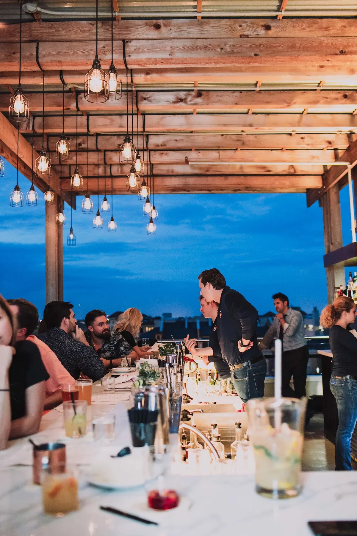 Luna Lounge's rooftop terrace in the evening, overlooking Sweeping views of downtown Tampa skyline in Hyde Park, Tampa.