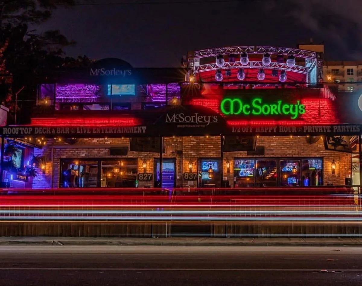 McSorley’s Beach Pub & Rooftop's rooftop terrace in golden-hour light, overlooking the Atlantic from Fort Lauderdale Beach.