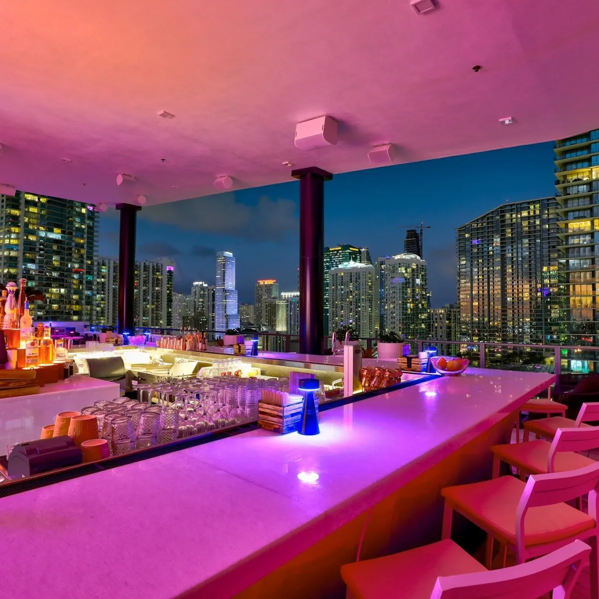 Rosa Sky's rooftop terrace at night, overlooking Panoramic city skyline views, Brickell Miami in Brickell, Miami.